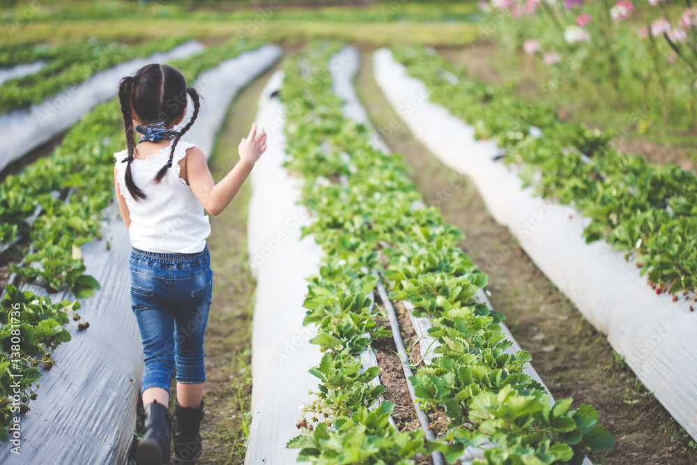 child running in the garden