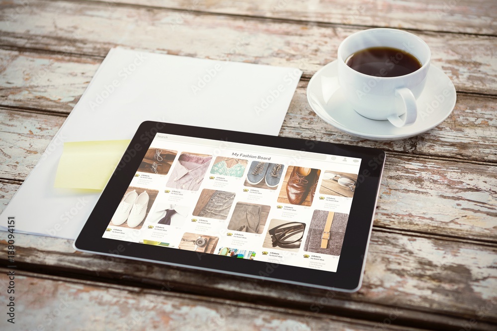 Composite image of overhead of tablet on desk