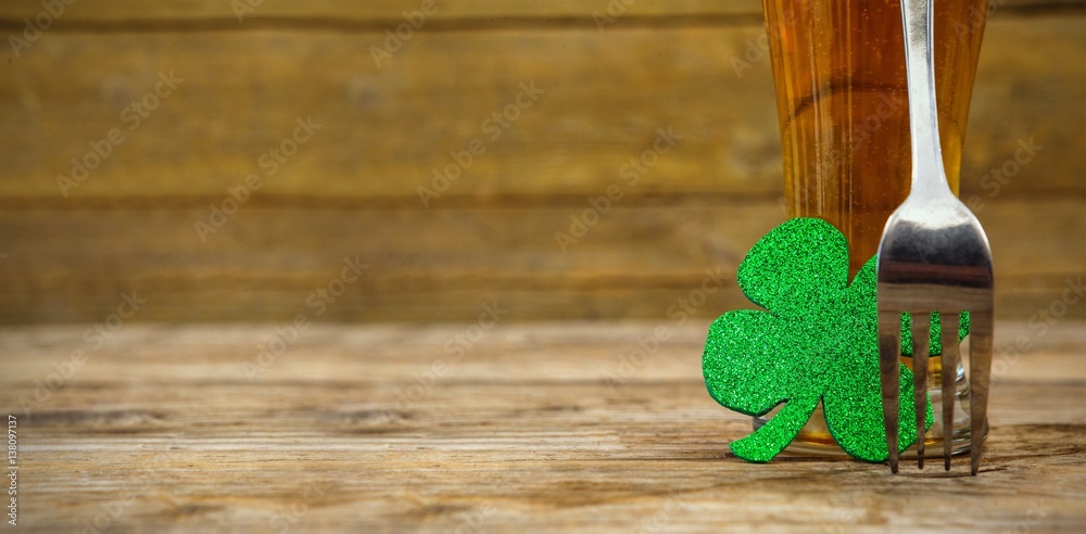 Beer glass with fork and shamrock for St Patricks Day