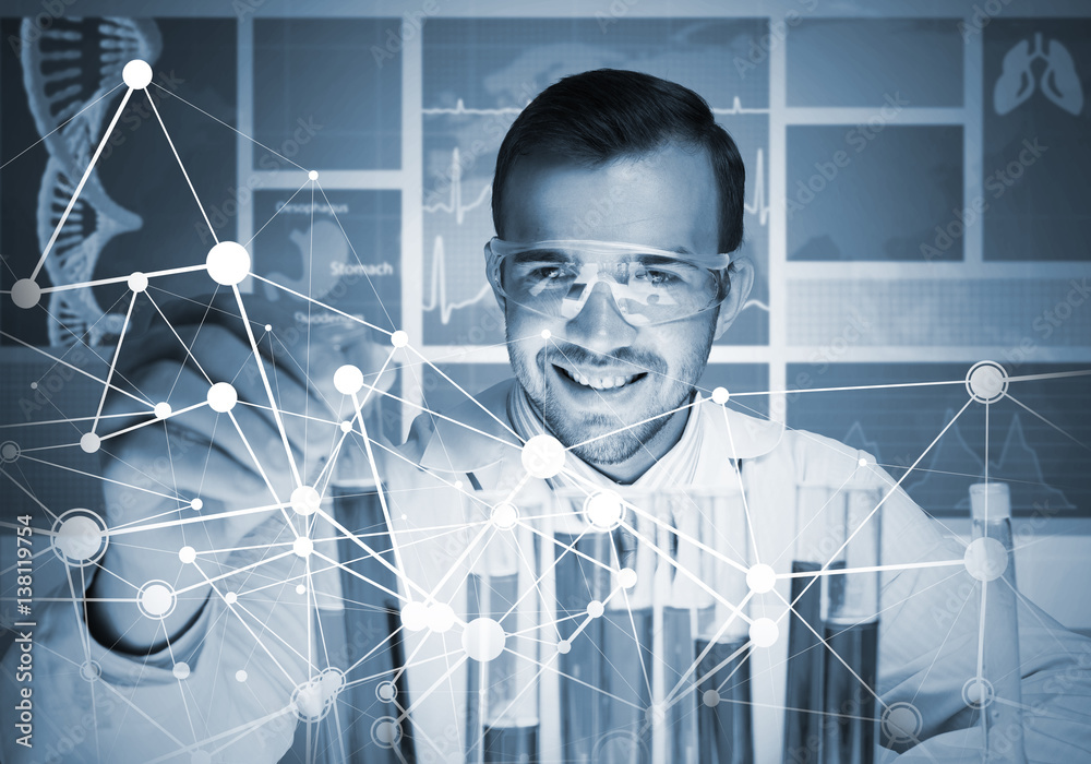 Portrait of concentrated male scientist working with reagents in laboratory