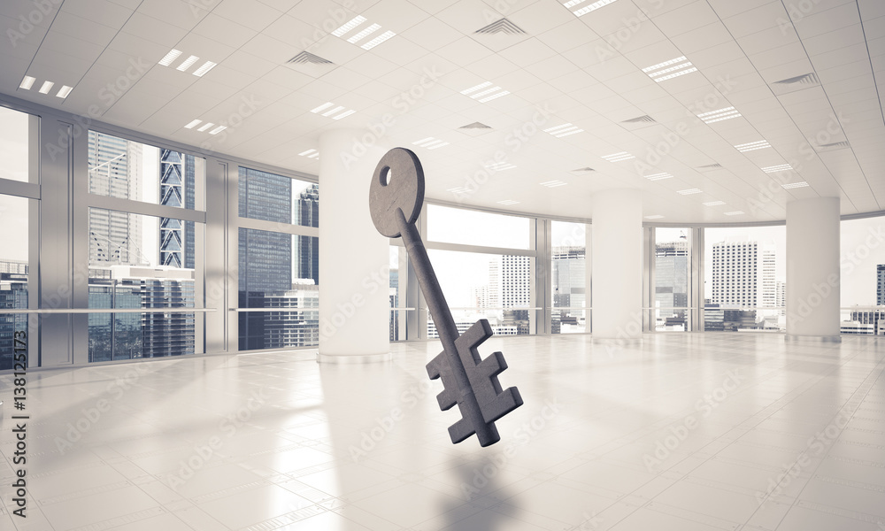 Conceptual background image of concrete key sign in modern offic