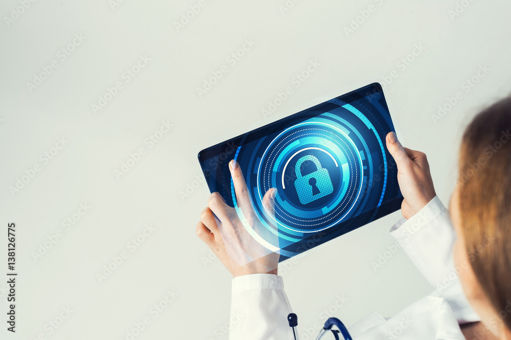 Close of female doctor hands working with tablet pc computer