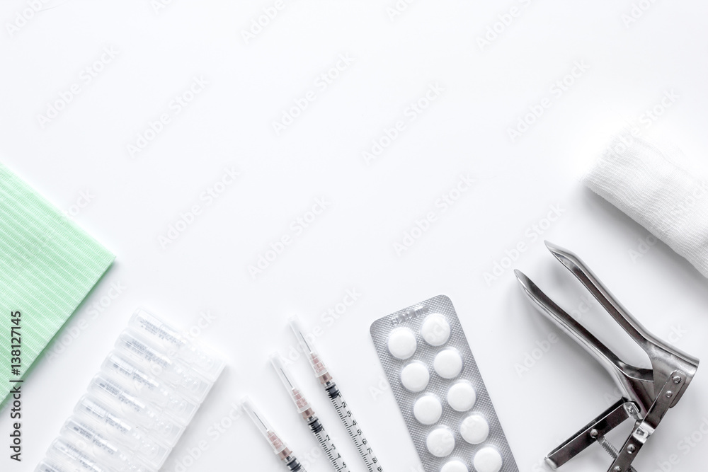 instruments of gynecologist on white background top view mock up