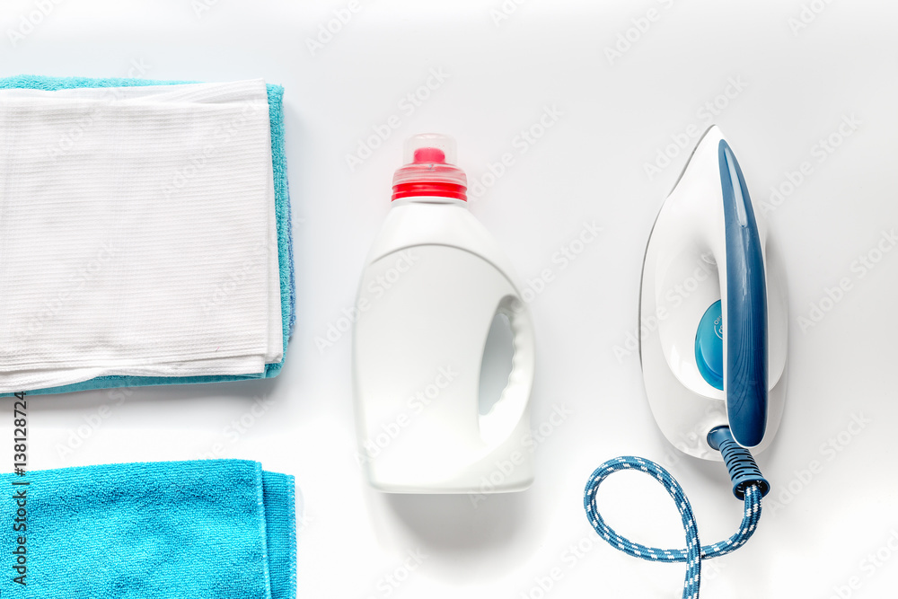 laundry set with towels and plastic bottels on white background top view