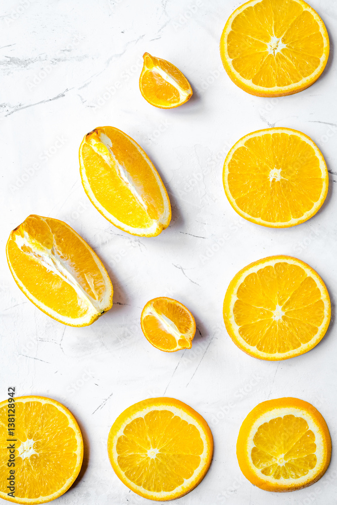 Slices for orange juice on white background top view pattern