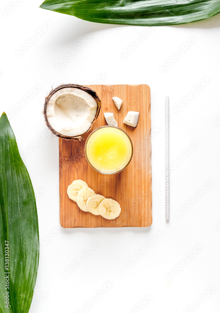 cocktail with coconut on white background top view