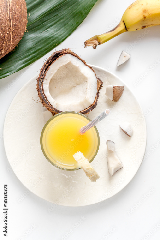 cocktail with coconut on white background top view