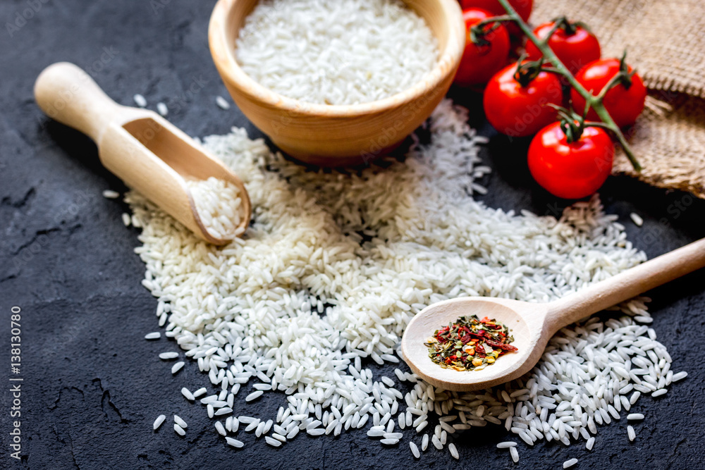 ingredients for paella on dark background