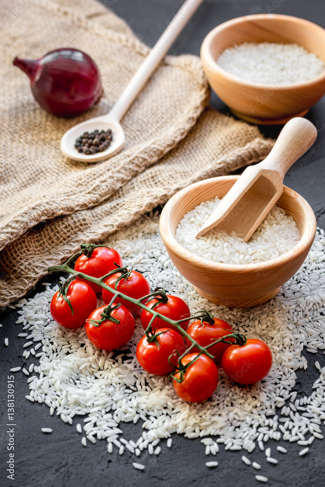 ingredients for paella on dark background