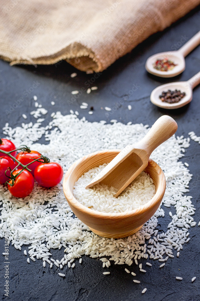 ingredients for paella on dark background