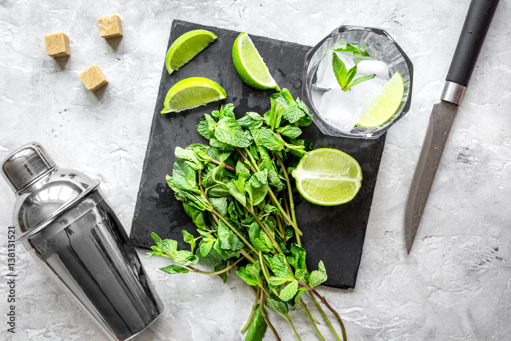 making mojito on stone background top view