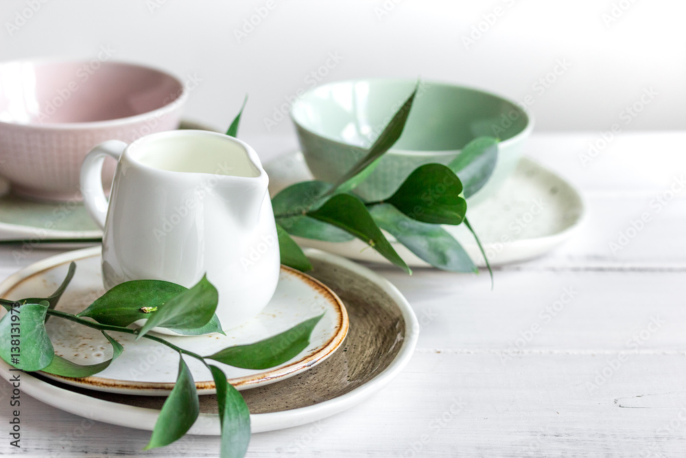 ceramic tableware with flowers on white background