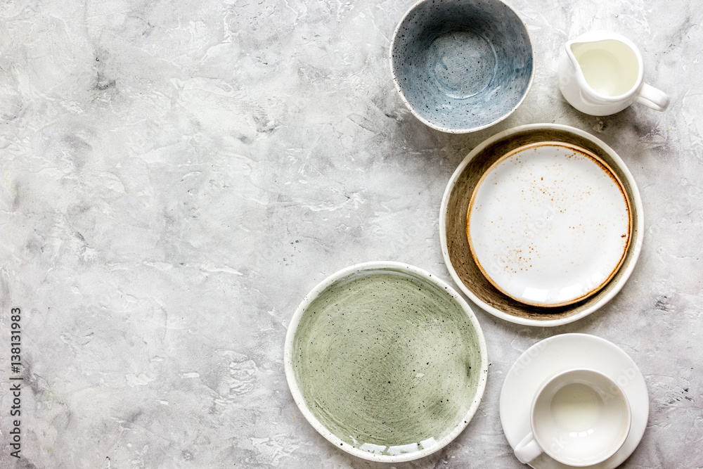 ceramic tableware top view on stone background mock up