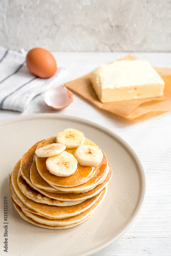 cooked pancake on plate at wooden background