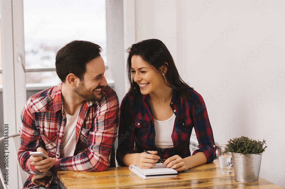 Couple working from home on project together