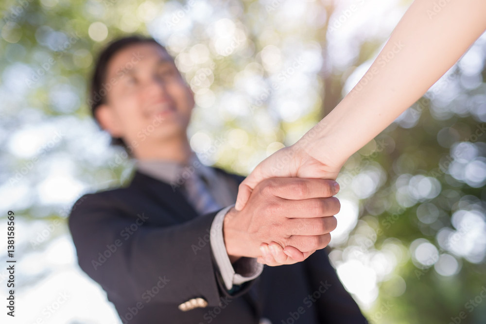 businessman shake hand in outdoor