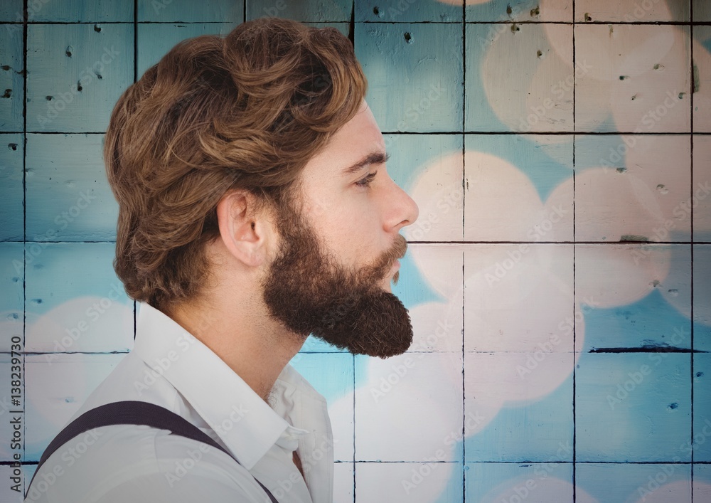 Man with beard against tiles with bokeh background