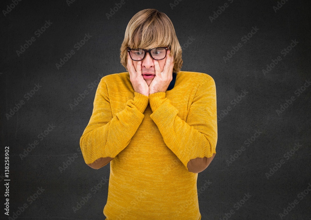 Composite image of stunned Man in yellow against grey background