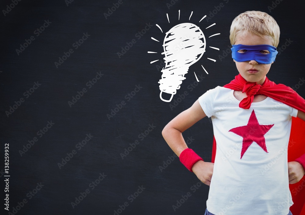 kid and blackboard with lightbulb against a black background