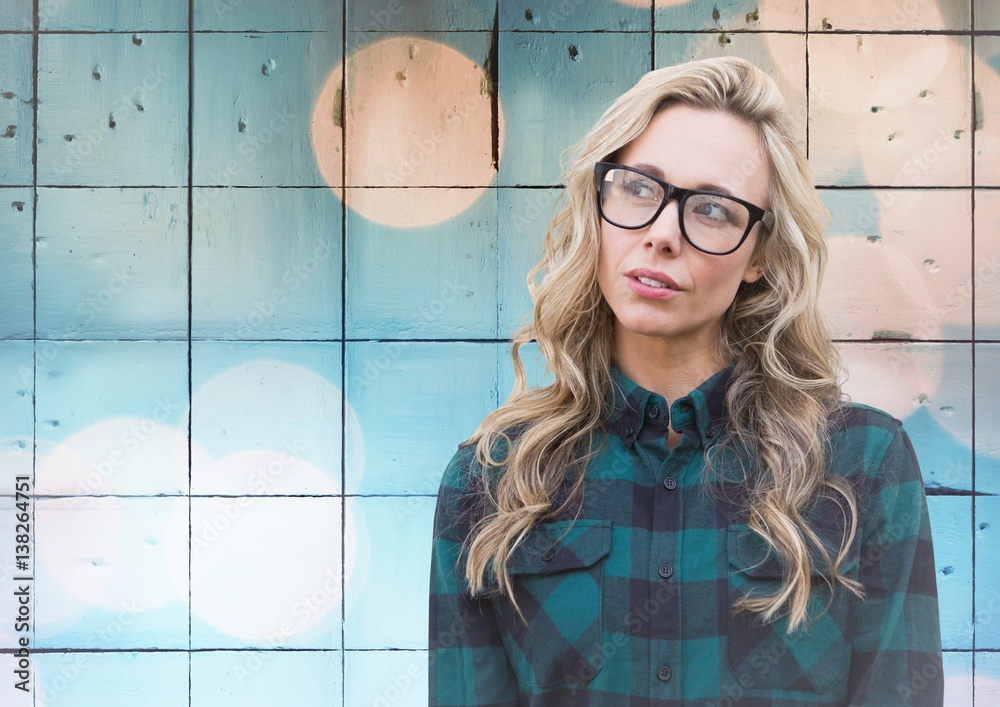 Woman with glasses against tiles with bokeh background