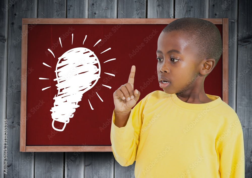 kid and blackboard with lightbulb against a wood background