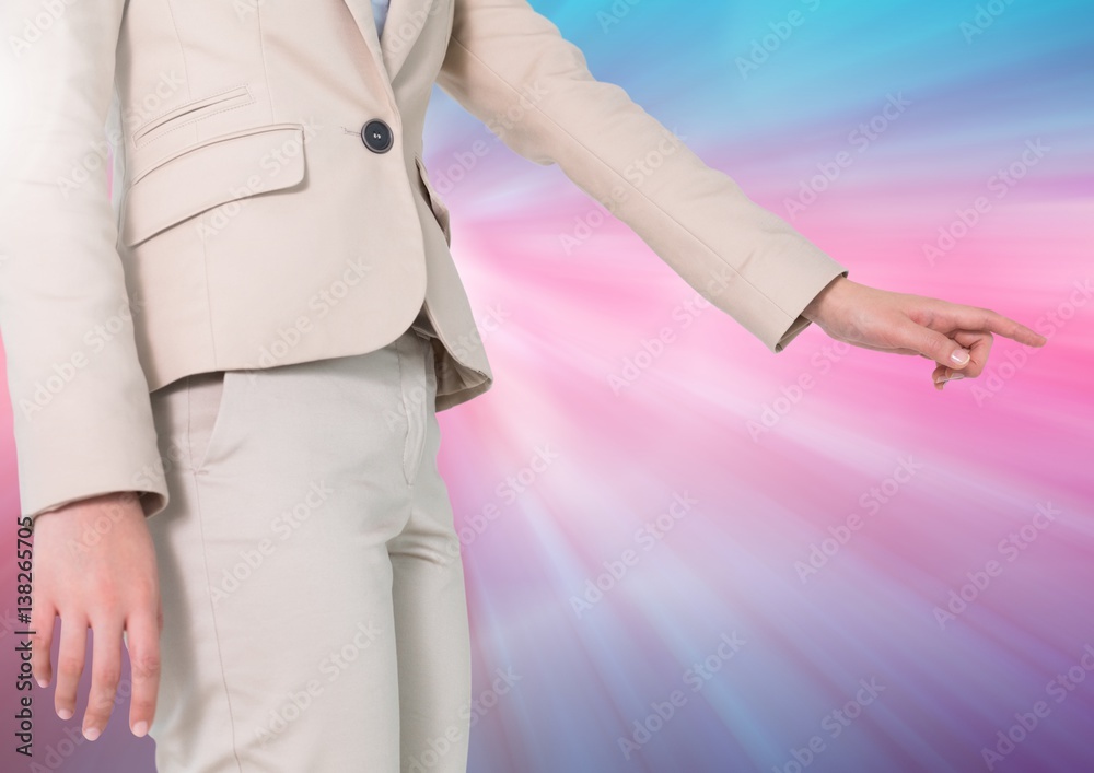 Businesswoman Hand pointing against a colorful background