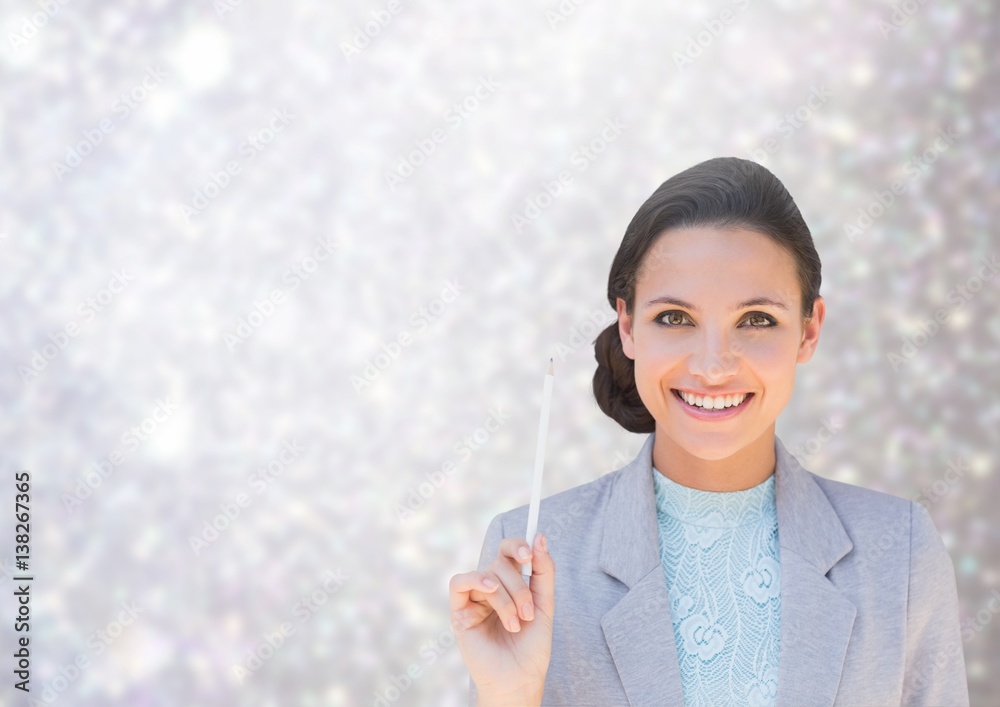 Woman smiling at camera against shining grey background 