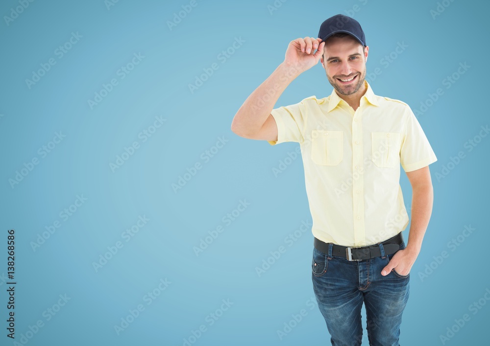 Happy Man holding his hat against blue background