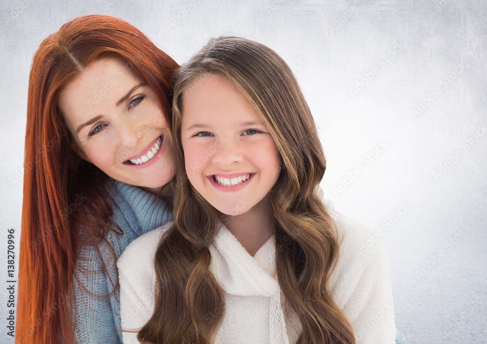 Mother and daugther against a neutral background