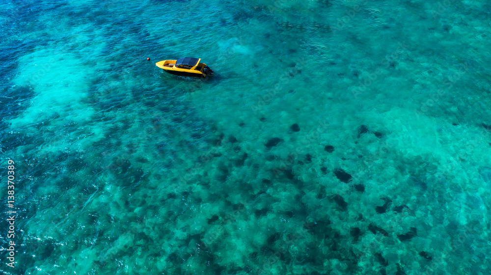 Speed boat in the sea.Aerial view. Top view.amazing nature background.The color of the water and bea