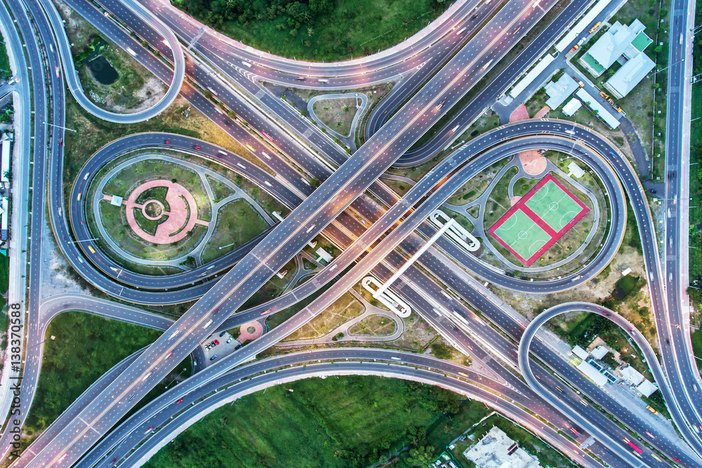 The light on the road  roundabout at night and the city in Bangkok, Thailand. Aerial view, Top view.