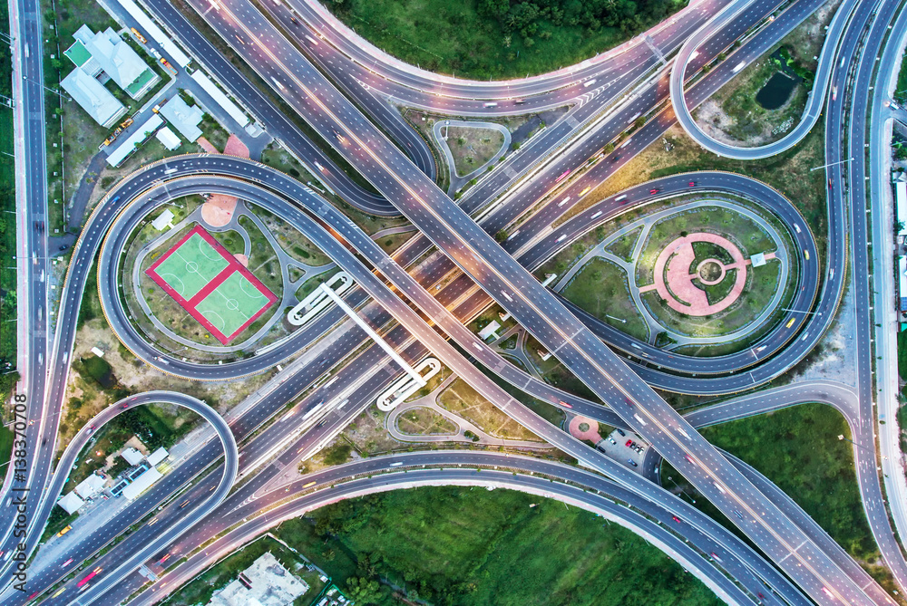 The light on the road  roundabout at night and the city in Bangkok, Thailand. Aerial view, Top view.