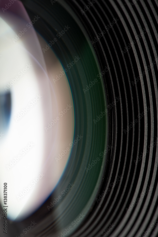 Camera lens close-up on black background