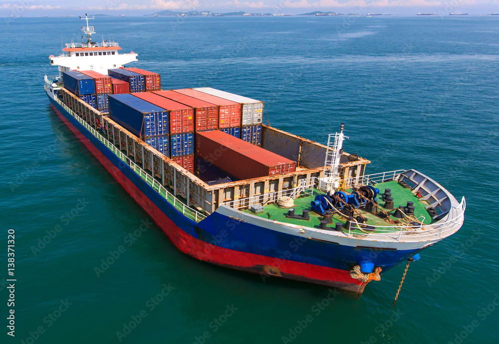 container ship in import export and business logistic.By crane ,Trade Port , Shipping,cargo to harbo