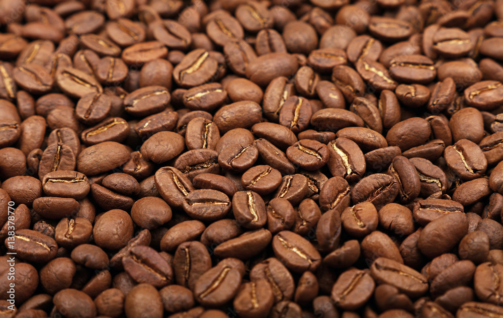 Roasted Arabica coffee beans background high angle