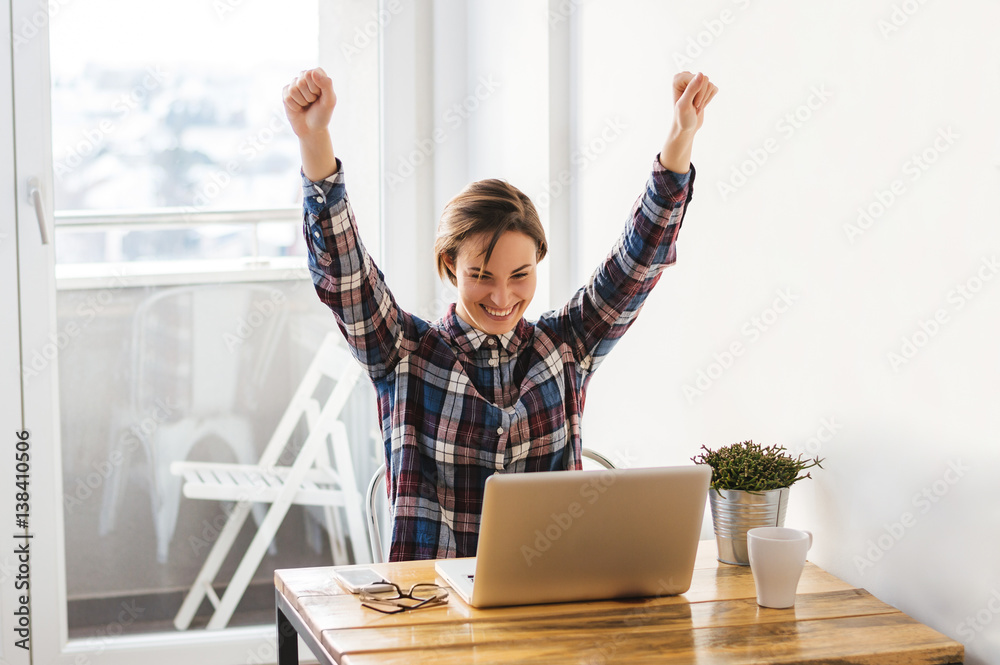 Excited casual entrepreneur girl reading good news