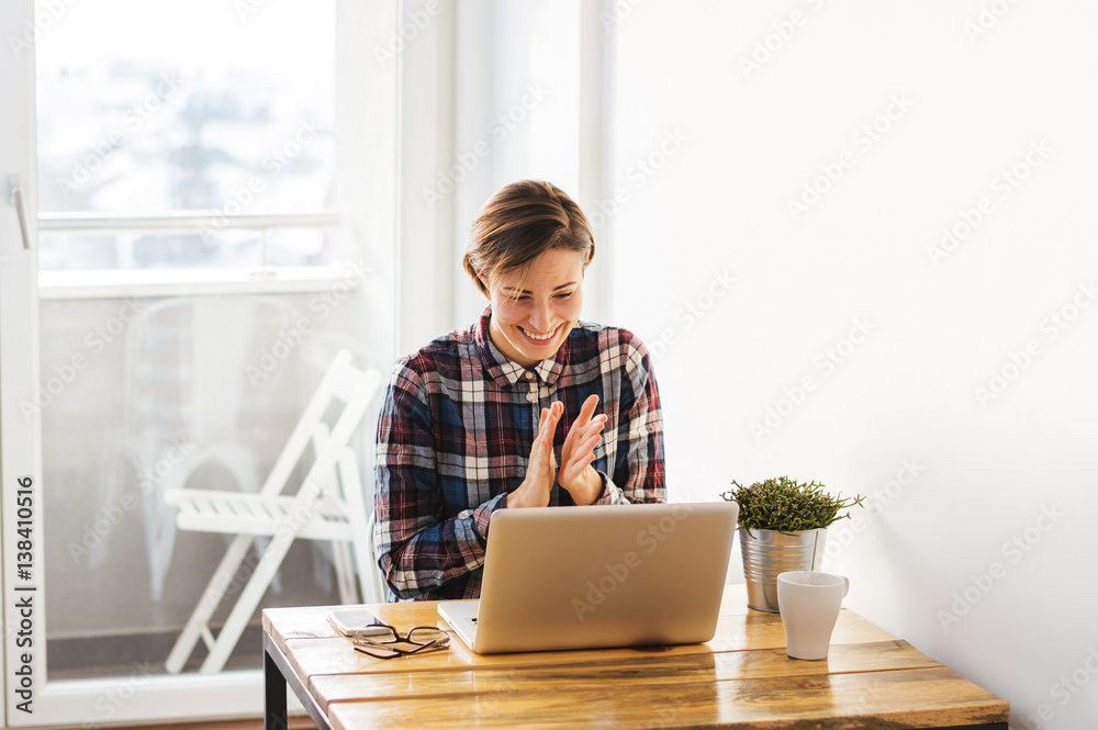 Excited casual student girl reading good news