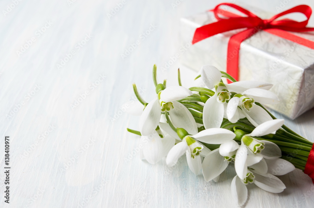 Snowdrops bouquet and a present box