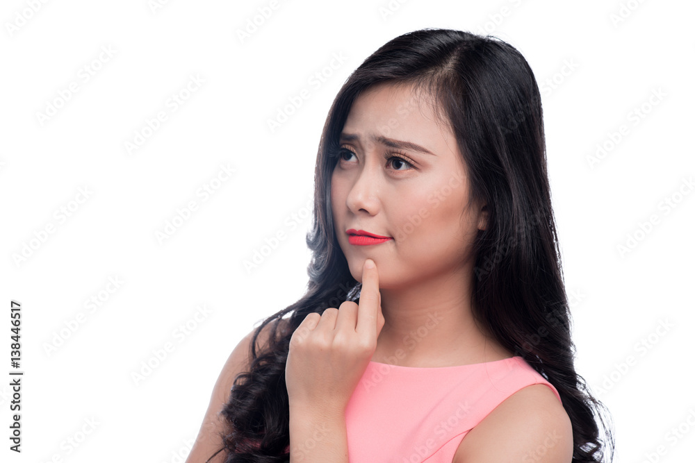 Asian young beautiful woman thinking and standing over white.