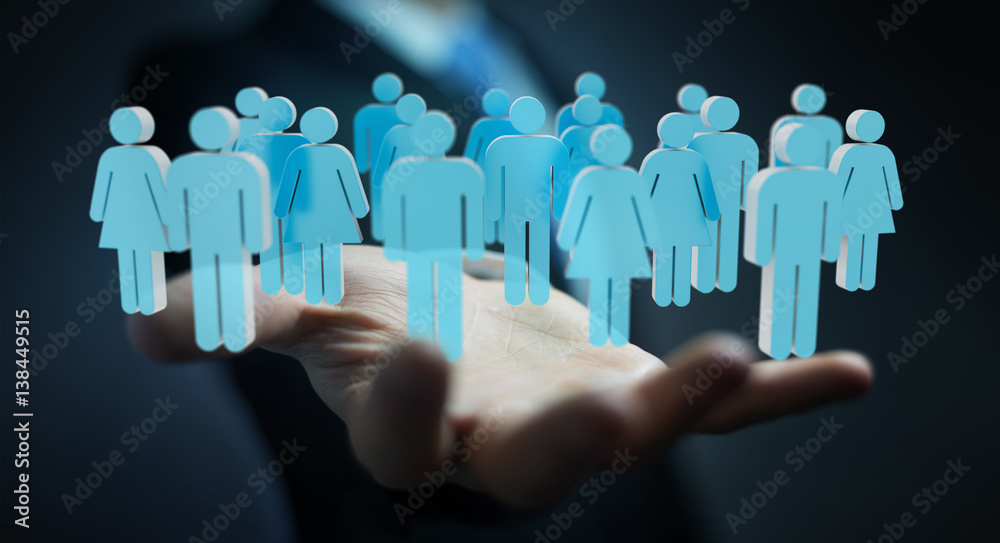 Businessman holding 3D rendering group of people in his hand