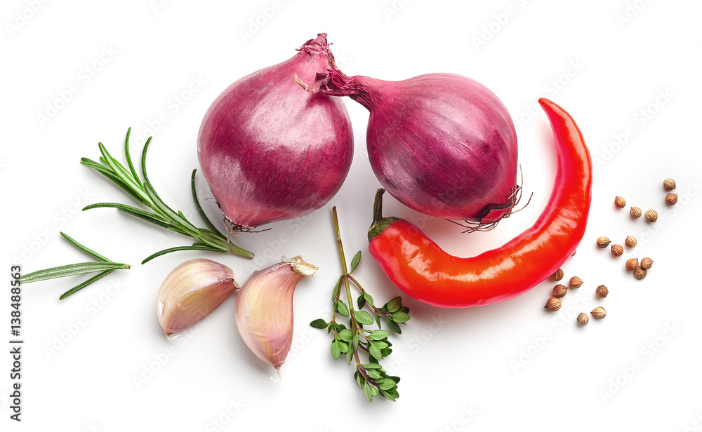 red onions and spices on white background