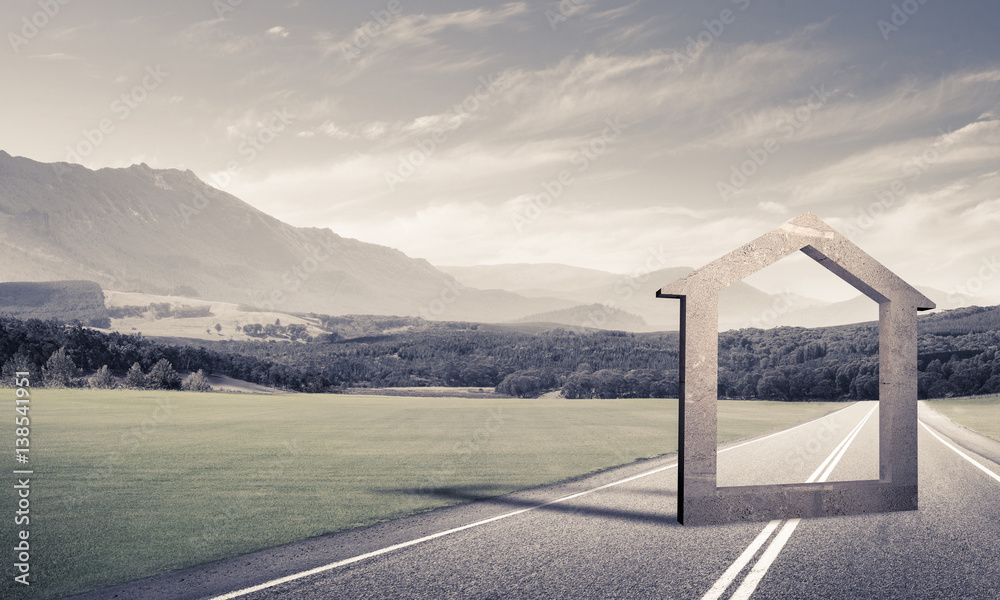 Conceptual background image of concrete home sign on asphalt roa