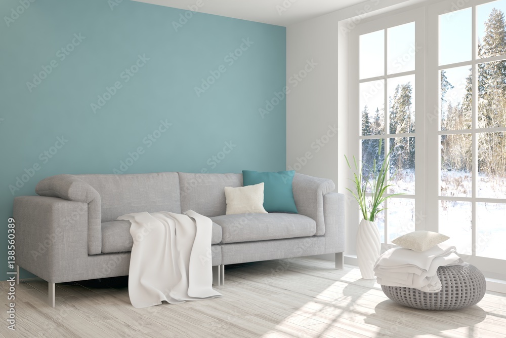 White room with sofa and winter landscape in window. Scandinavian interior design