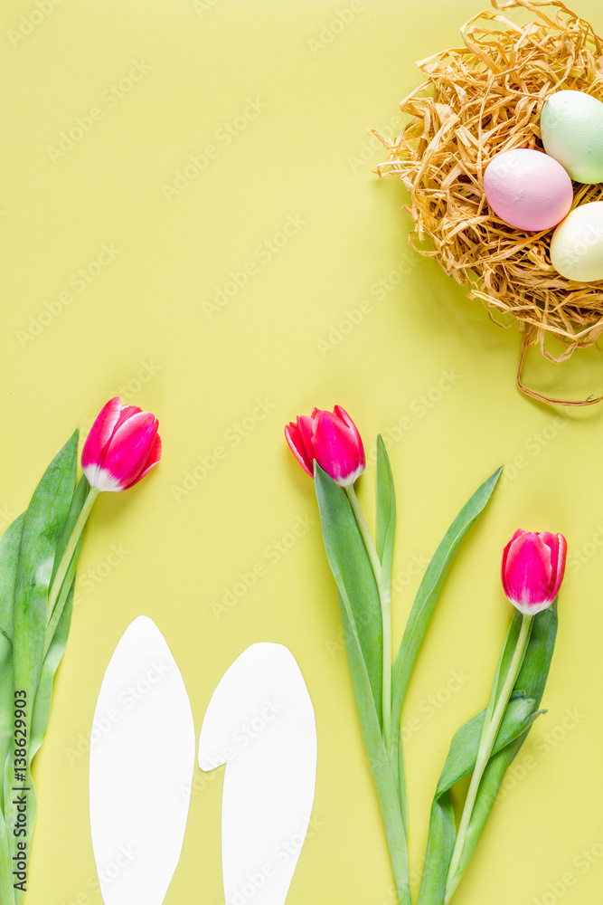 Easter concept on yellow background top view mockup