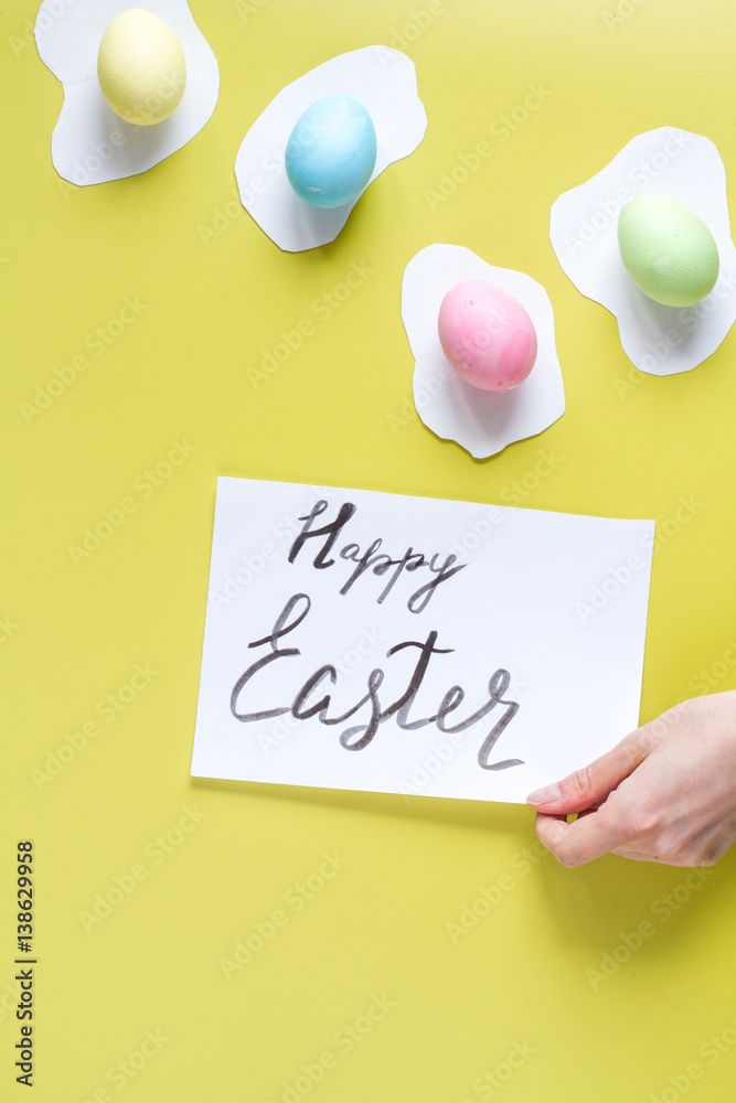 Easter concept on yellow background top view mockup