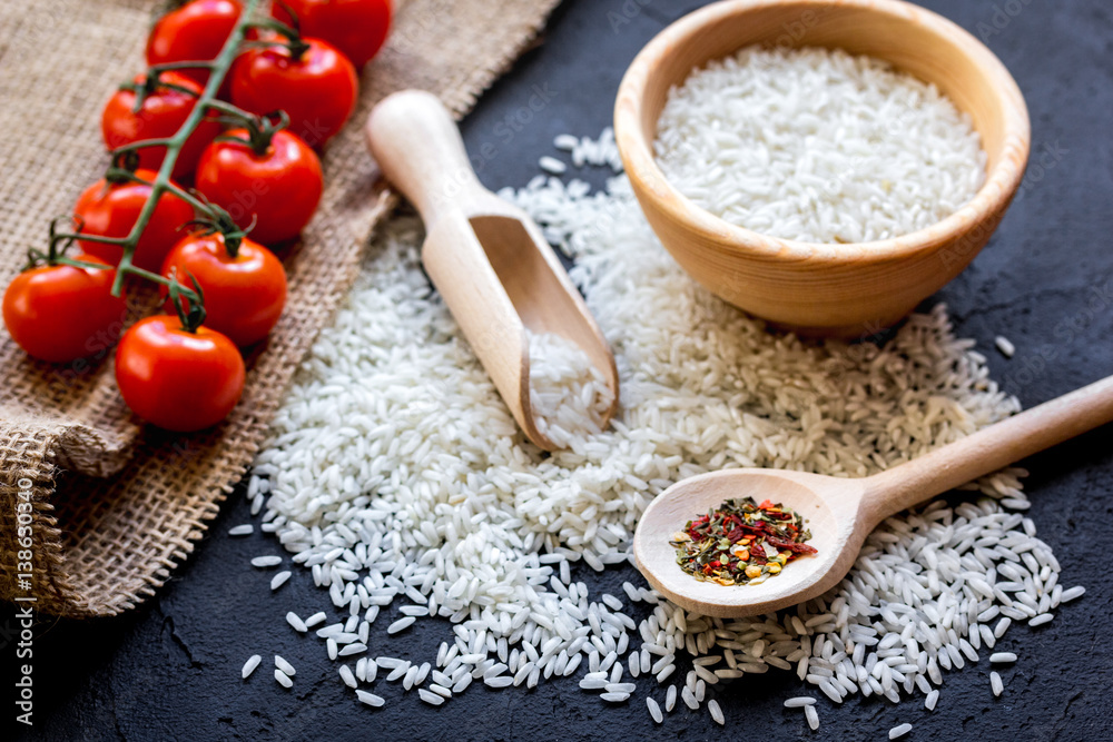 ingredients for paella on dark background