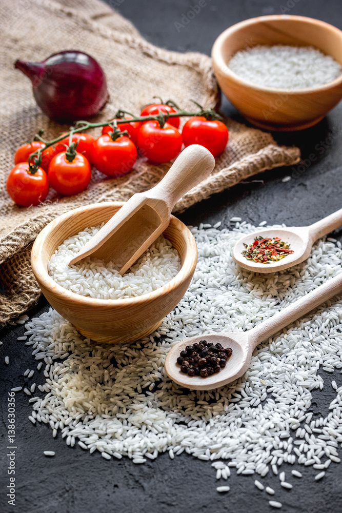 ingredients for paella on dark background