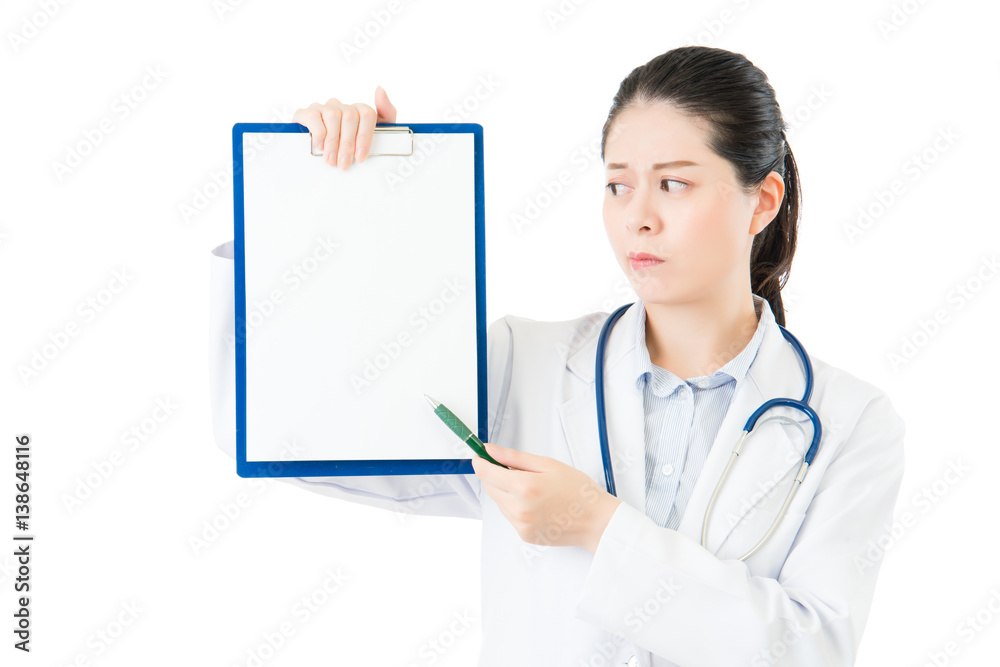 beauty asian doctor pointing showing blank clipboard