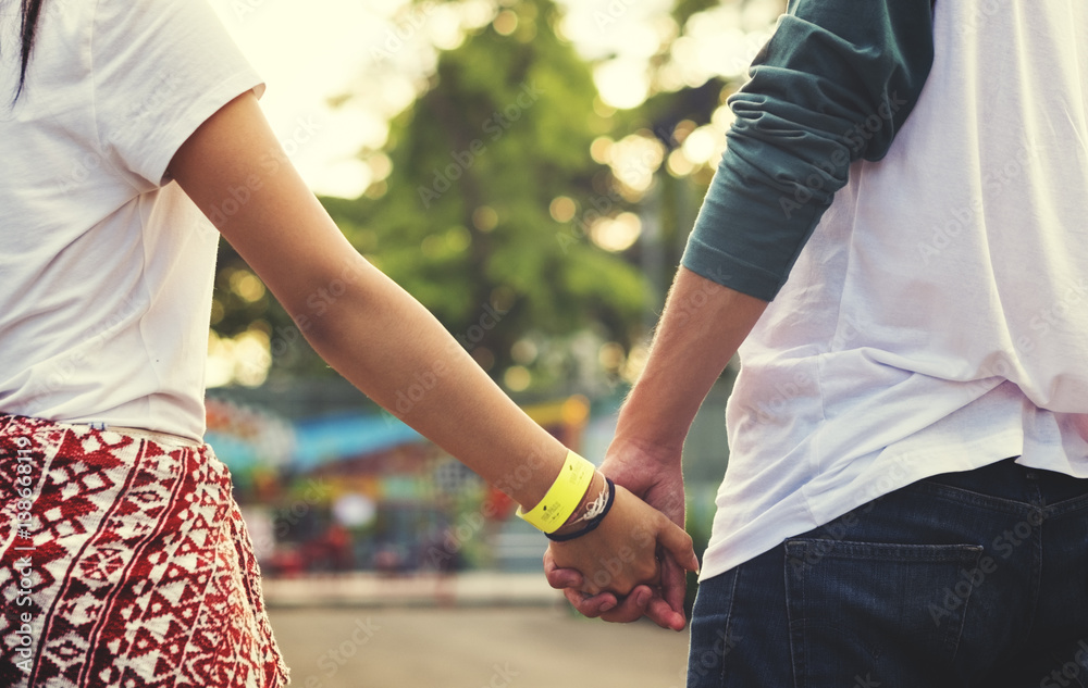 Young Couple Date Holding Hands Concept