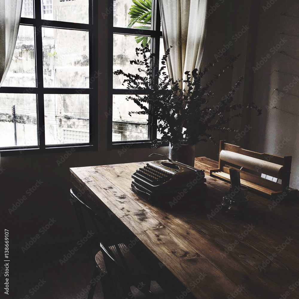 Dark room with table and typewriter